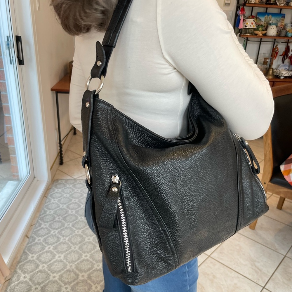 Black leather shoulder bag with silver details